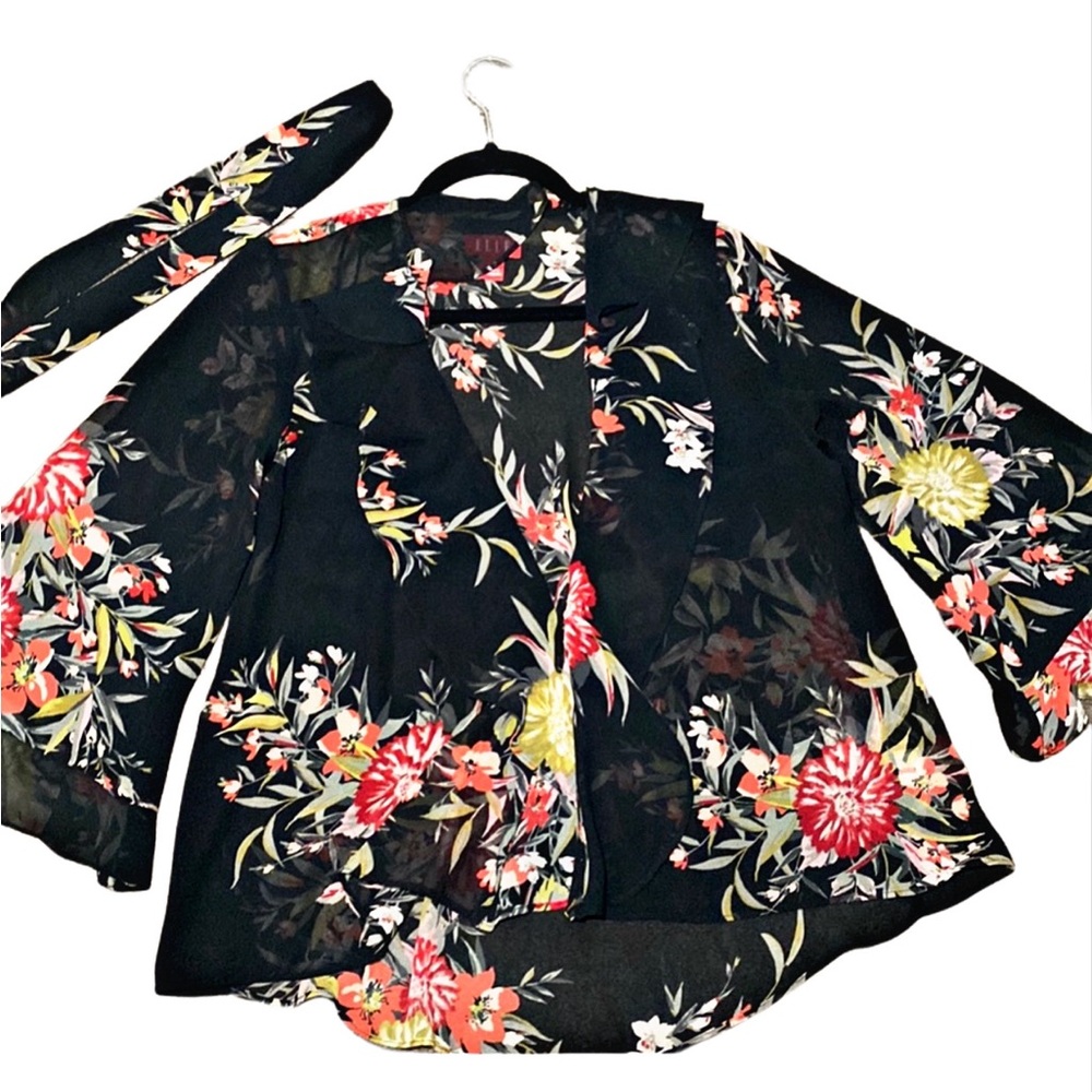 Elle open from black floral blouse with tie